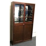 20th century pine mirror back display cabinet with sliding glass doors revealing two shelves