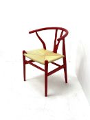 After Hans Wegner - 'Wishbone' style armchair with deep red finish and corded seat