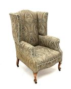 Early 20th century high wing back sprung armchair