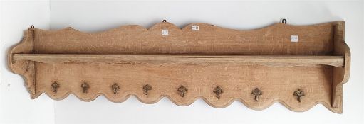 Early 20th century French oak shelf above 8 metal hooks