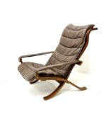 Siesta lounge chair upholstered in dark tan leather