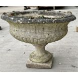 Low composite stone urn on square base