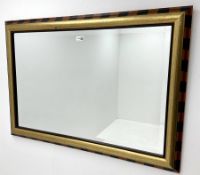 Gilt framed rectangular bevel edge wall mirror with stripped border