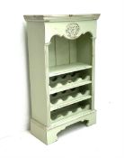 Painted pine twelve bottle wine rack with additional single shelf