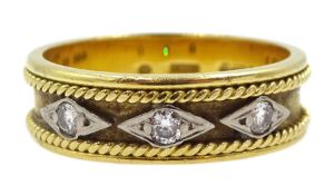 18ct gold band set with three round brilliant cut diamonds in a diamond shaped setting