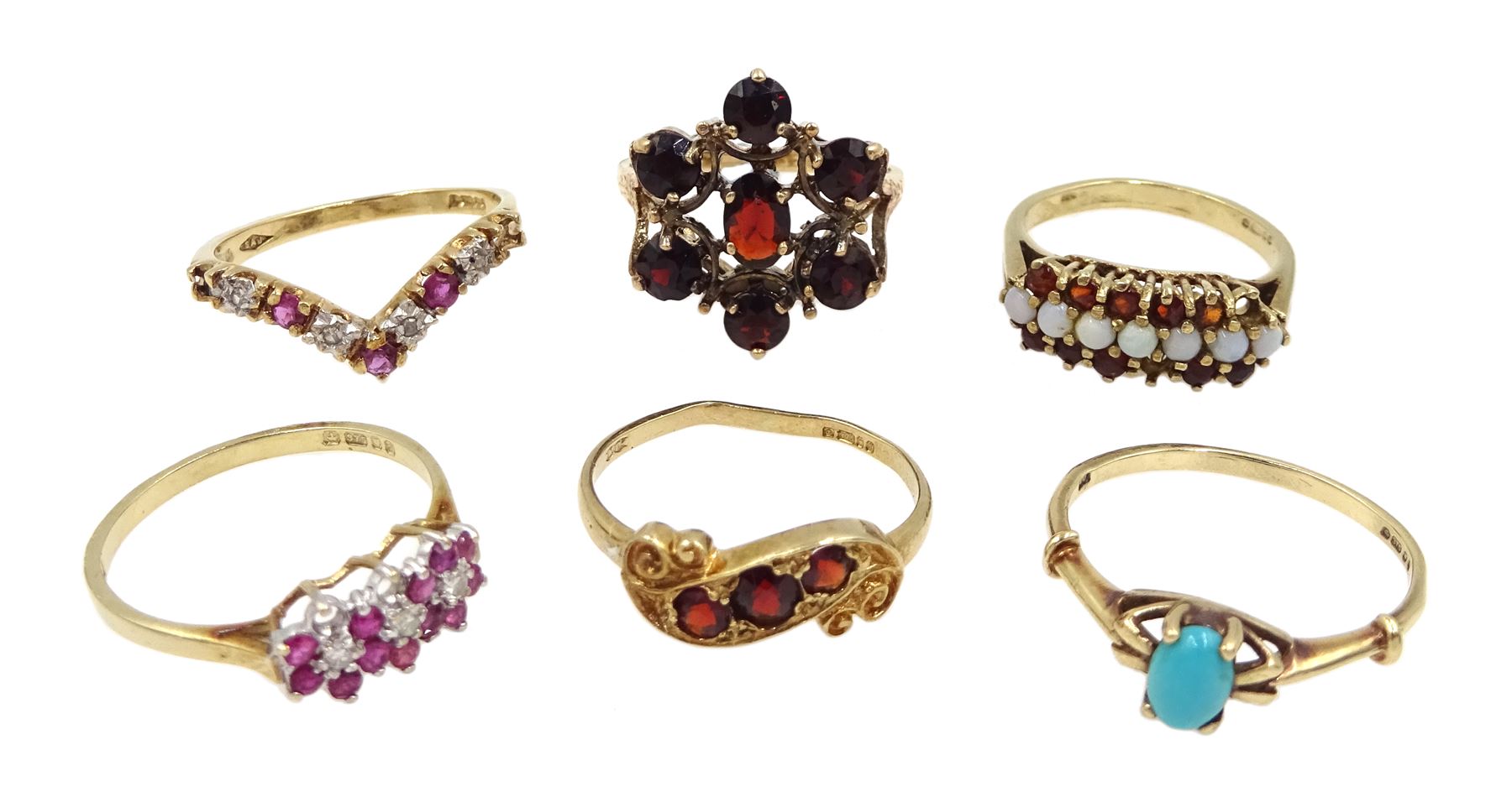 Gold garnet cluster ring and garnet three stone ring