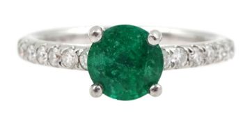 Platinum round emerald ring