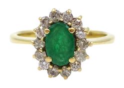 18ct gold oval emerald and diamond cluster ring