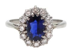 Platinum oval sapphire and diamond cluster ring