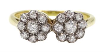 Early-mid 20th century diamond ring consisting of two diamond flower head clusters