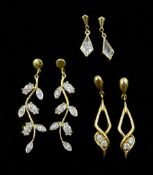 Two pairs of gold cubic zirconia pendant earrings and a pair of gold crystal pendant earrings