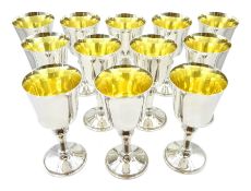 Set of twelve silver goblets with gilt interiors by W I Broadway & Co