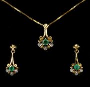 Gold emerald and diamond pendant necklace and a pair of matching earrings