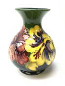 A Moorcroft vase of bulbous form with waisted neck decorated in the hibiscus pattern