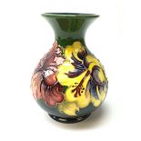 A Moorcroft vase of bulbous form with waisted neck decorated in the hibiscus pattern