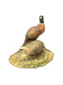 A North Light figure modelled as a cock and hen pheasant upon rocky ground