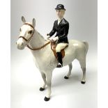 A Beswick equestrian figure modelled as a huntswoman on grey horse