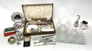 A cased silver mounted dressing table set