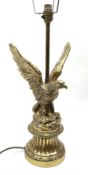 A brass table lamp modelled in the form of an eagle upon a circular base
