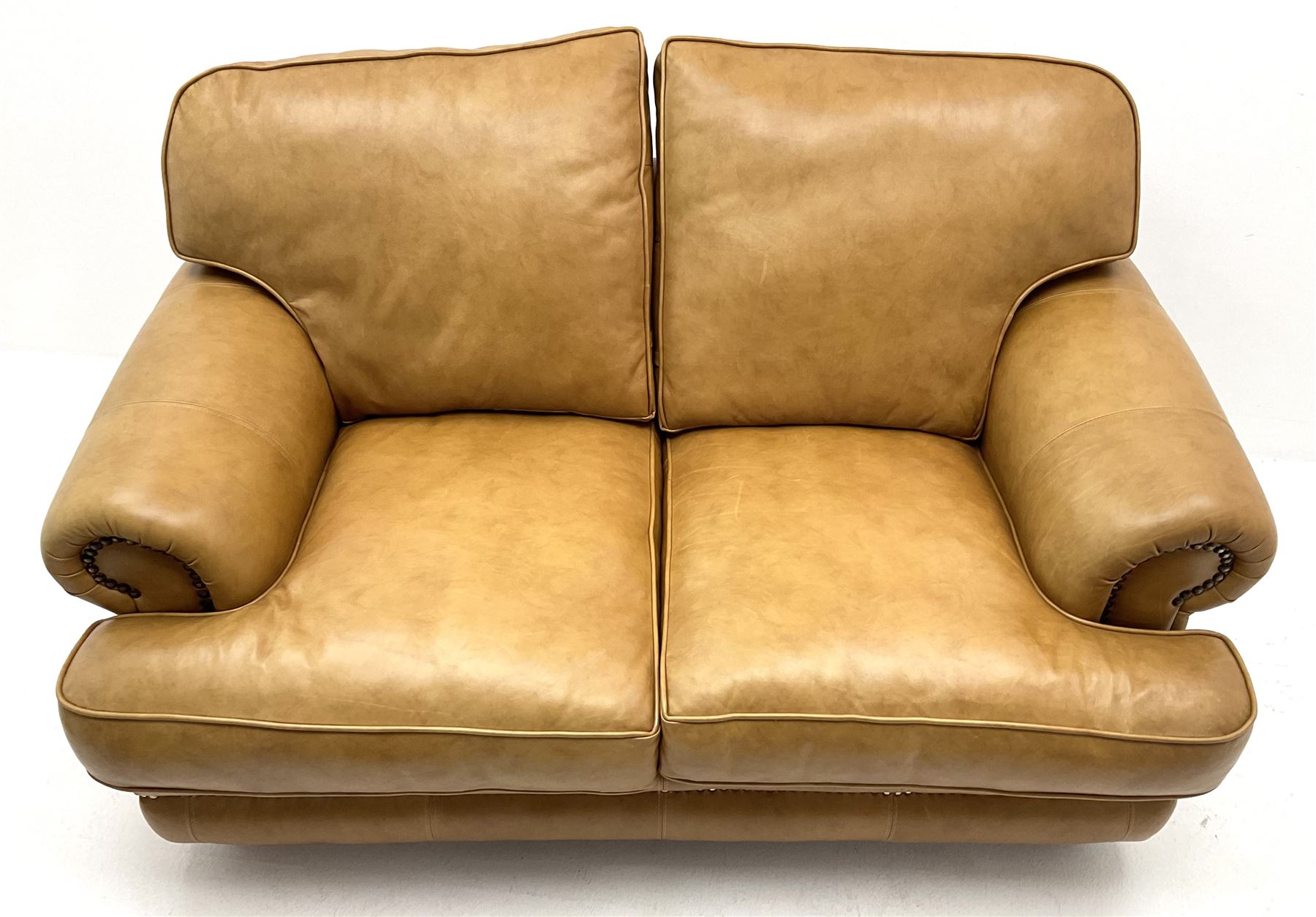 Two seat sofa upholstered in a studded tan leather - Image 2 of 7