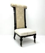 Victorian ebonised prie dieu chair upholstered in an ivory ground fabric