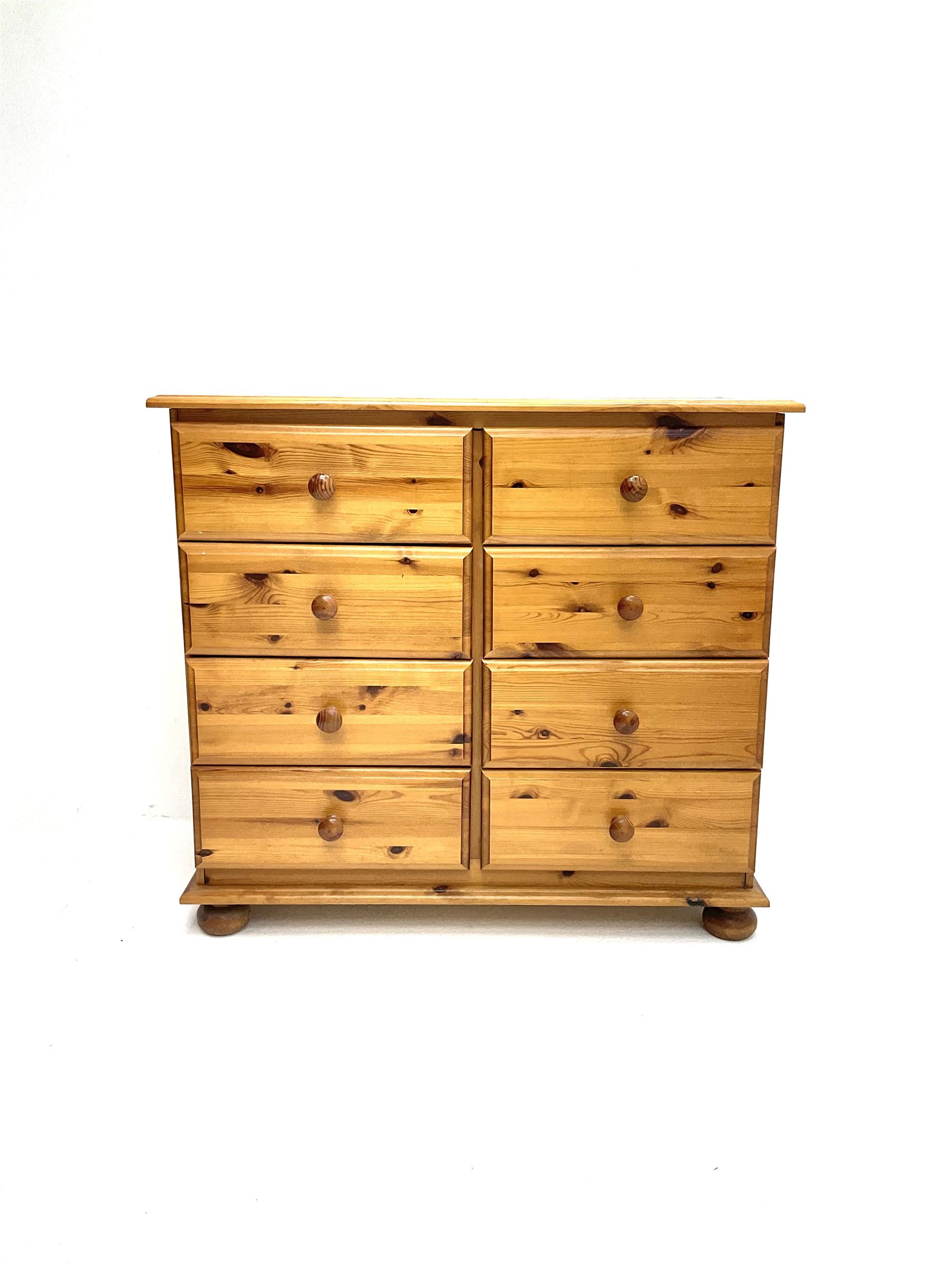 Polished pine chest fitted with eight drawers
