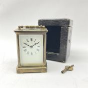 Early 20th century brass and bevelled glass carriage timepiece clock