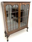 Early 20th century display cabinet enclosed by two astragal glazed doors