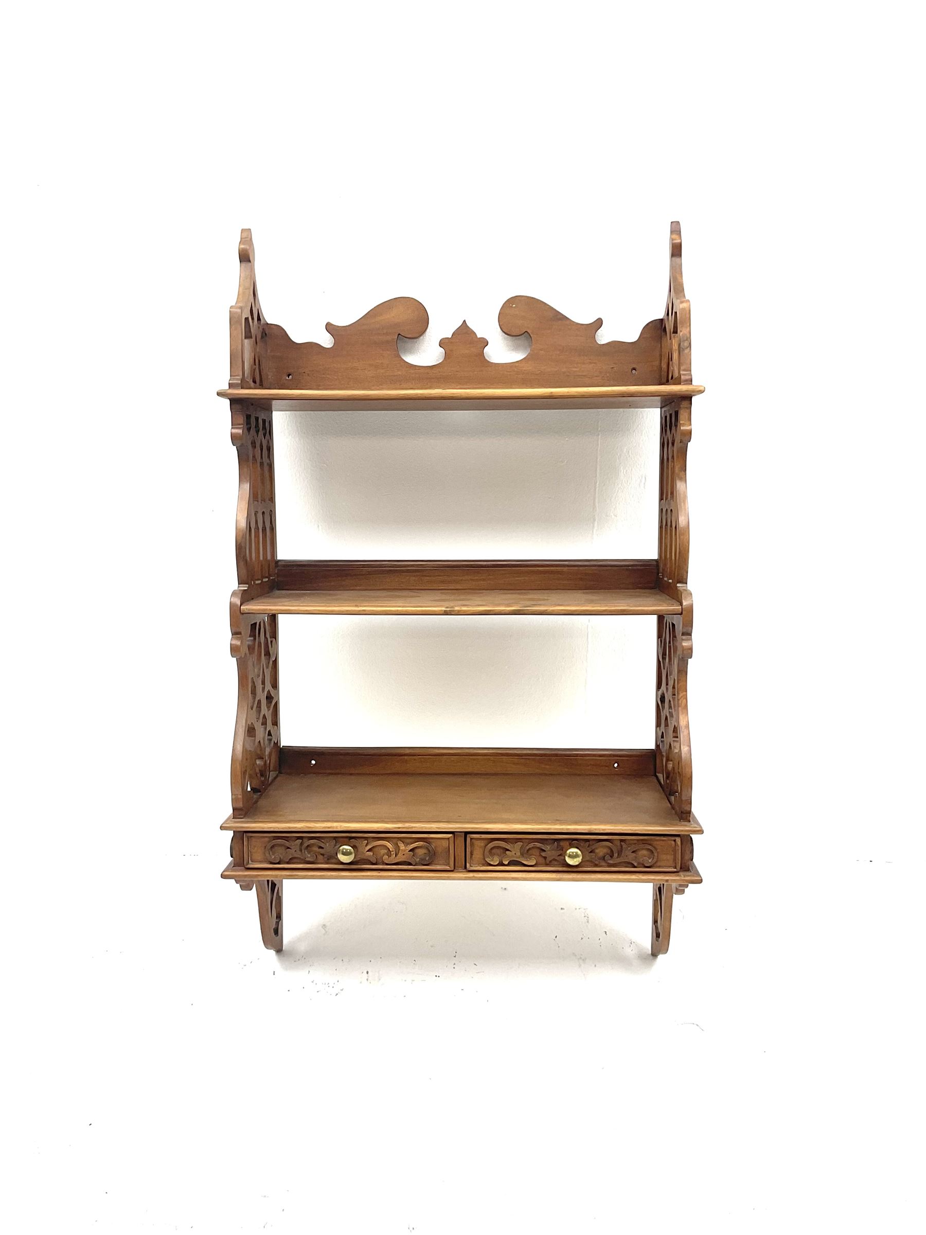 Mahogany open fretwork wall shelves with two drawers