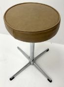 1970s stall with circular vinyl seat
