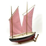 Mid-20th century pond yacht with red and black painted wooden hull