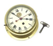 Ship's brass cased bulkhead clock by Cooke Hull with eight-day movement