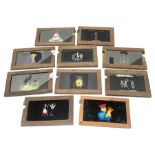 Ten 19th century wooden framed glass animated magic lantern 'slipping' slides of comical figures and