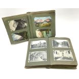 Two albums containing a quantity of Edwardian and later British and Continental topographical postca