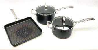 Three Le Creuset pans suitable for induction hobs inc. griddle pan