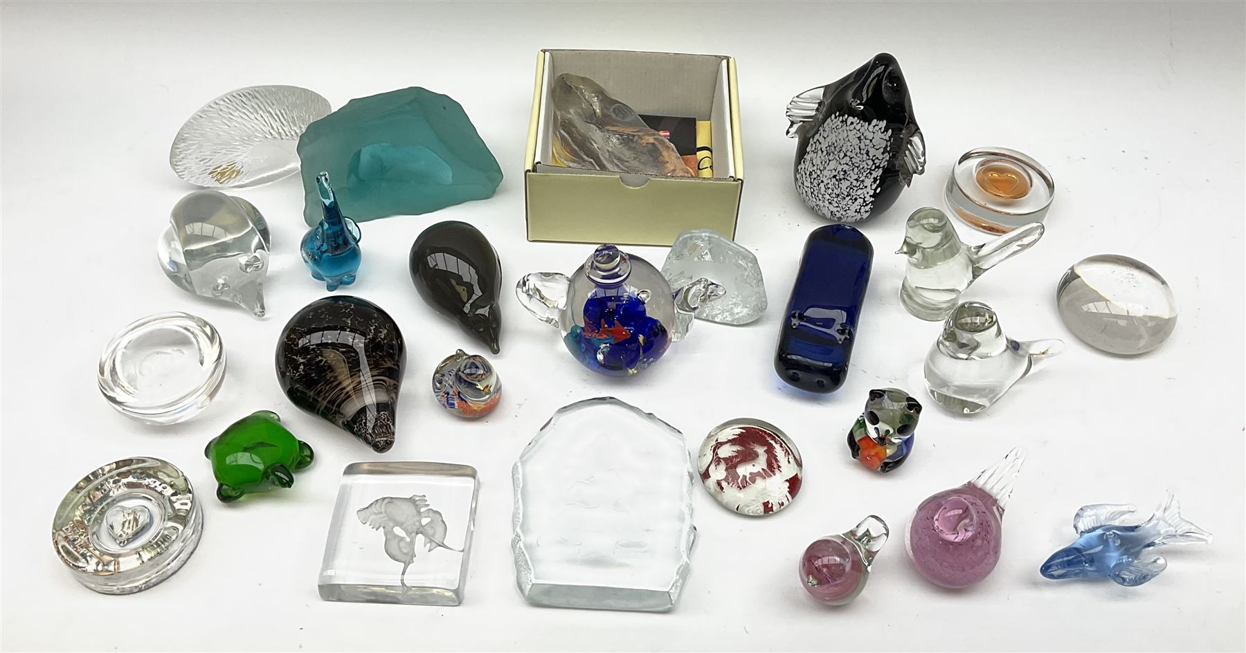 A group of assorted paperweights