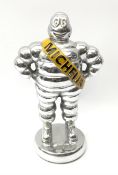 A polished aluminium Michelin man figure