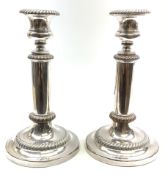 A pair of silver plated telescopic candlesticks