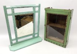 A light blue painted mirror with lower shelf