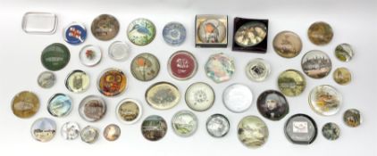 A large collection of glass paperweights