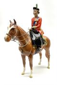 A Beswick model of HM Queen Elizabeth II mounted on Imperial Trooping the colour 1957