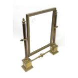 A brass table top swing mirror