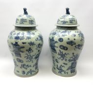 A large pair of 20th century Chinese blue and white vases and covers