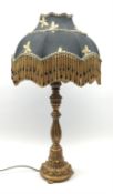 A composite gilt effect table lamp