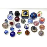 A group of assorted paperweights of various size and design