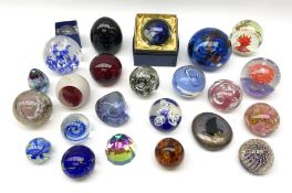 A group of assorted paperweights of various size and design