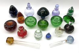 A group of glass paperweights modelled as various fruit