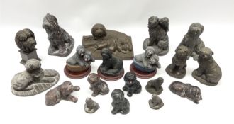 A group of bronzed dog figures