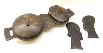 A carved wooden tray with twin bowls and twin handles