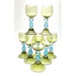 A set of eight German green glass hock glasses